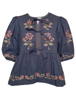 Embroidered Puff Sleeve Bottom Ruffle Front Tie Top in Navy