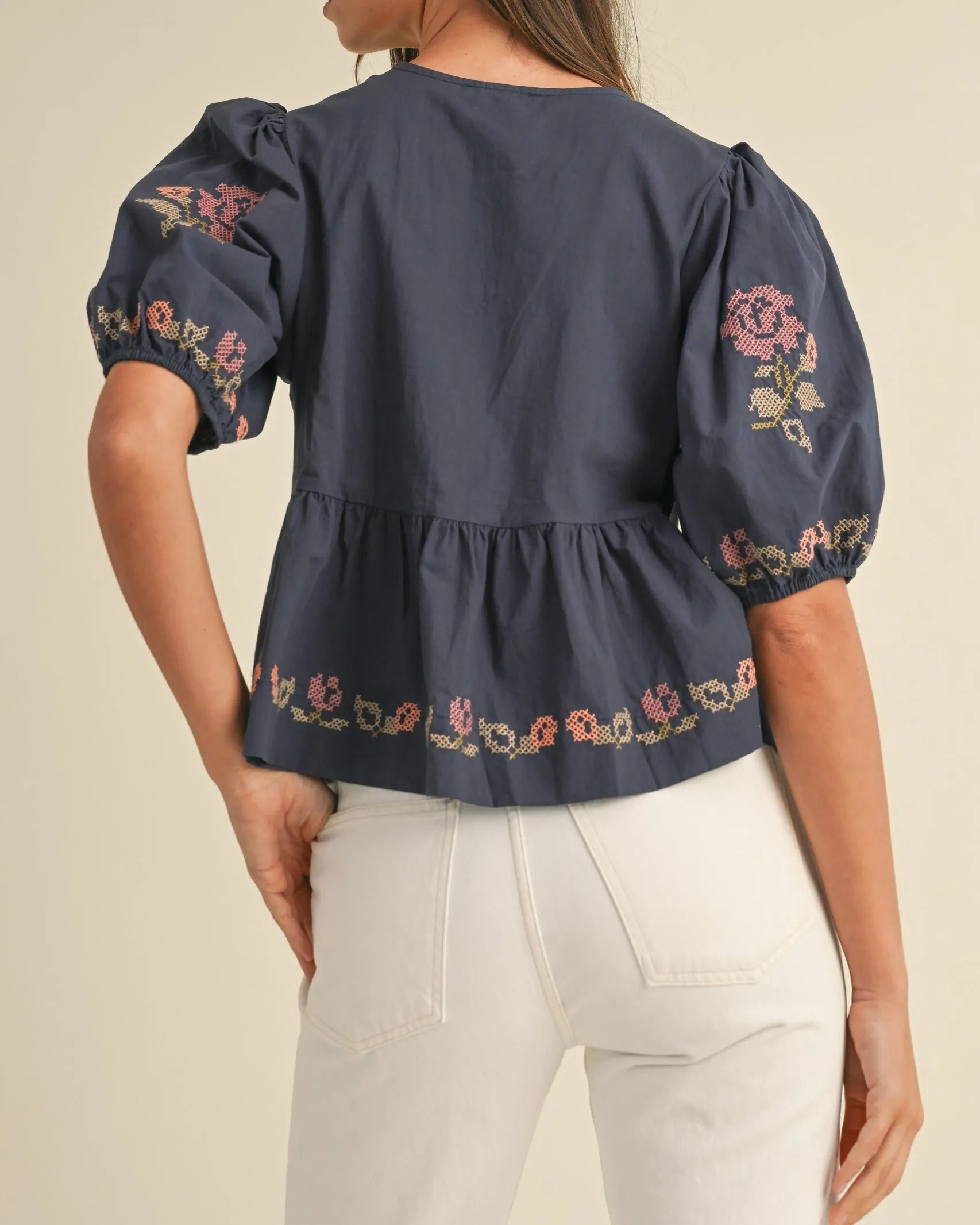 Embroidered Puff Sleeve Bottom Ruffle Front Tie Top in Navy
