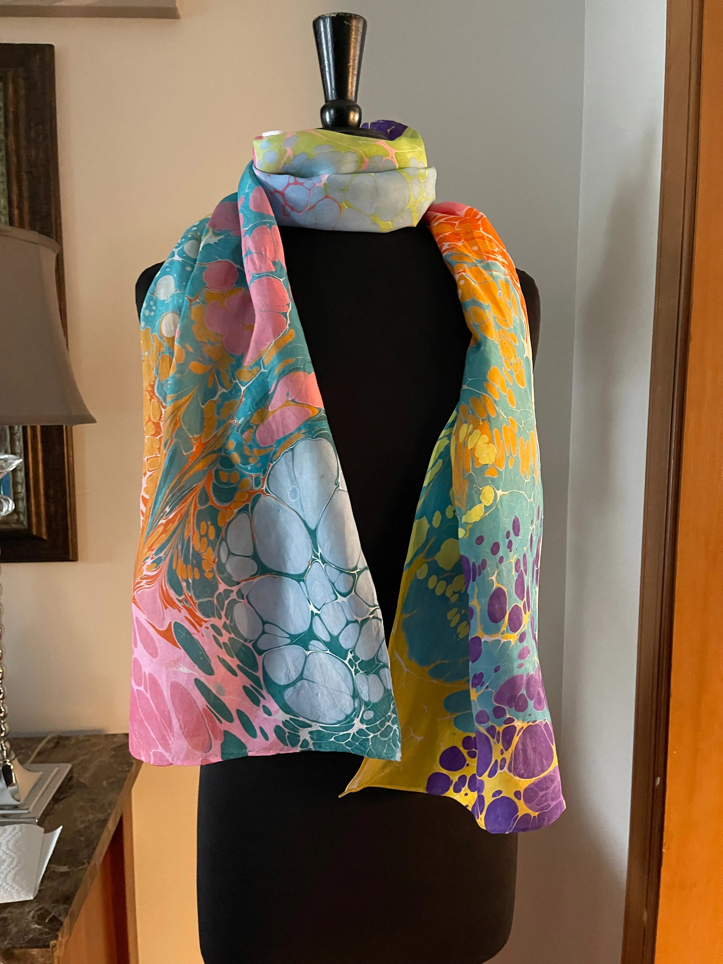 Summer color   water marbled 8mm Habotai silk.  Hang on the wall, use as a table runner or wear this unique piece