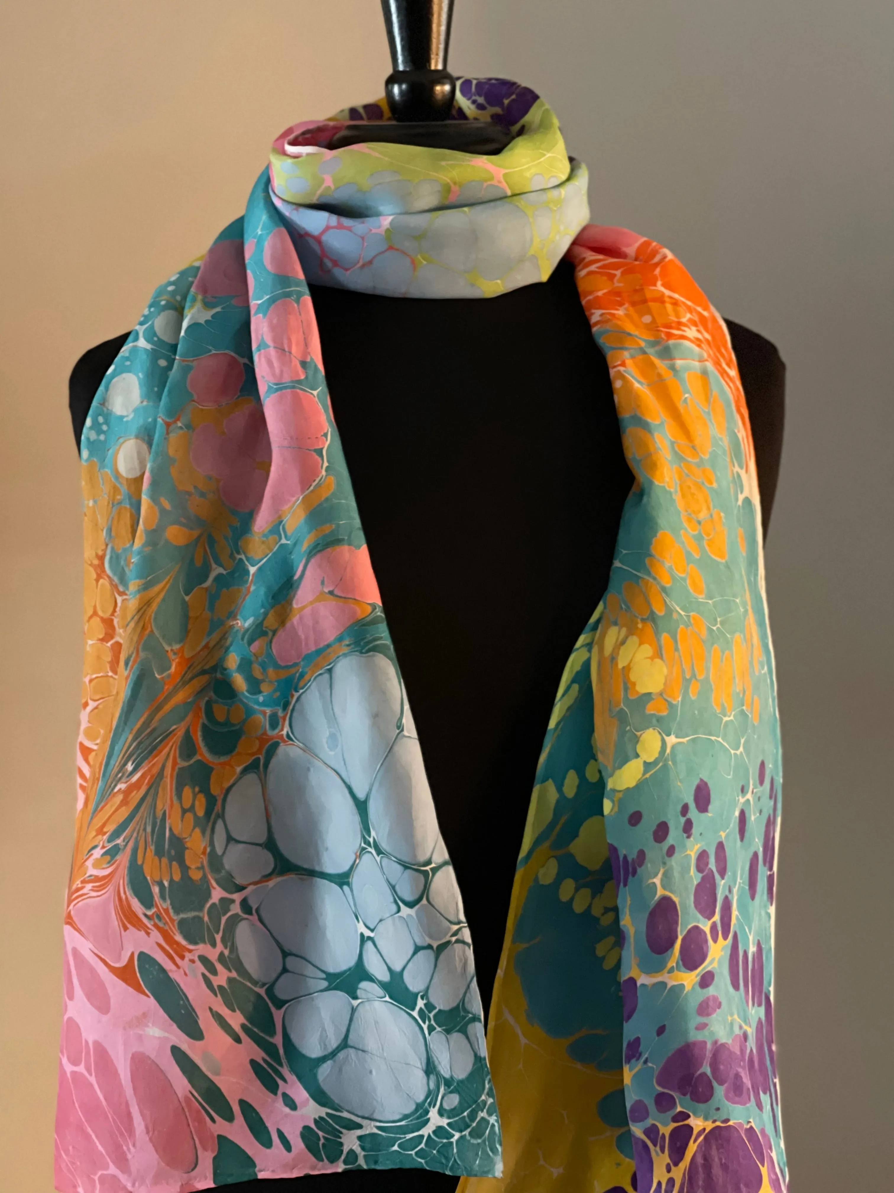 Summer color   water marbled 8mm Habotai silk.  Hang on the wall, use as a table runner or wear this unique piece