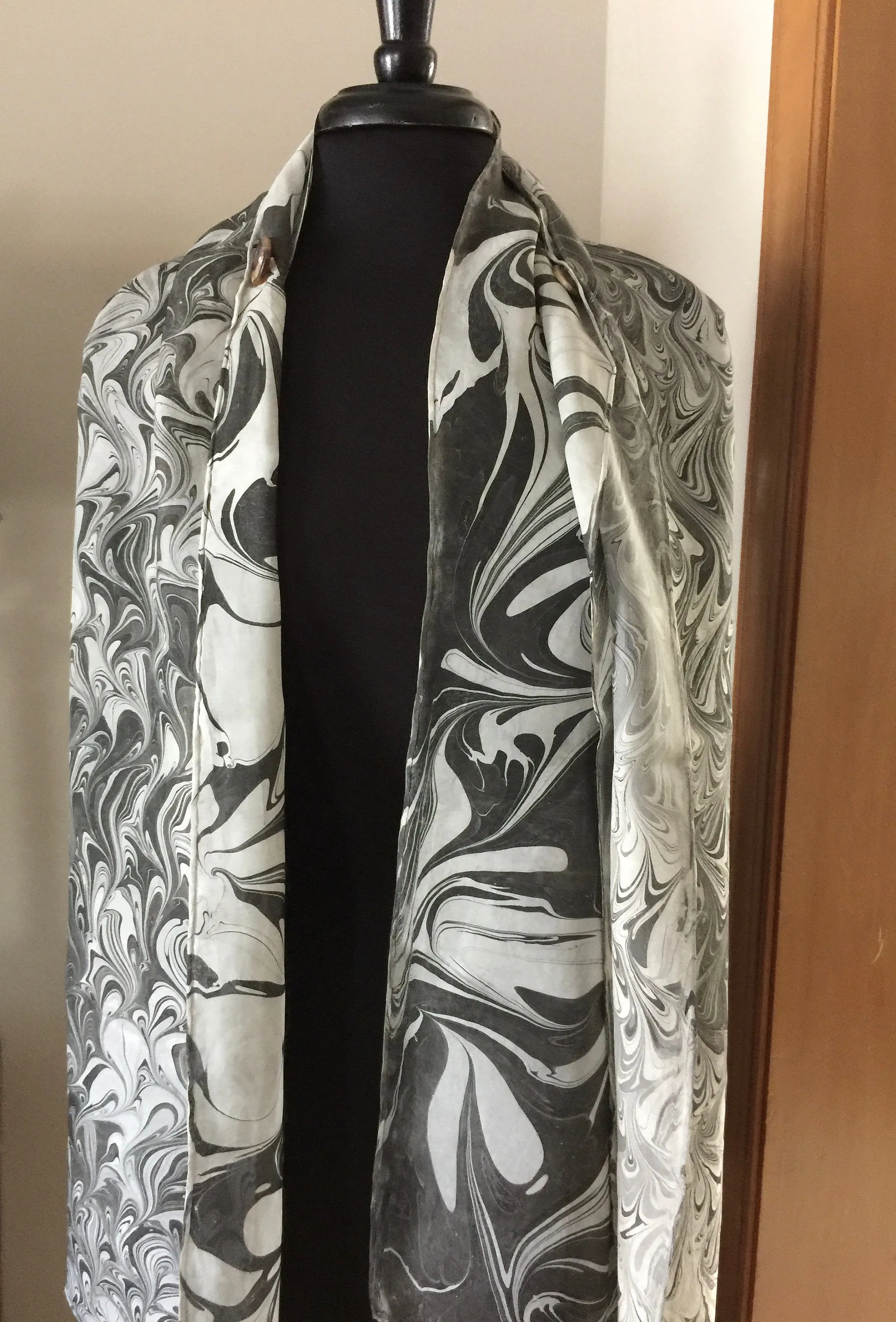 The Shibumi.  It’s a wrap, a shawl, a fashion statement!  Wear it 10 different ways!