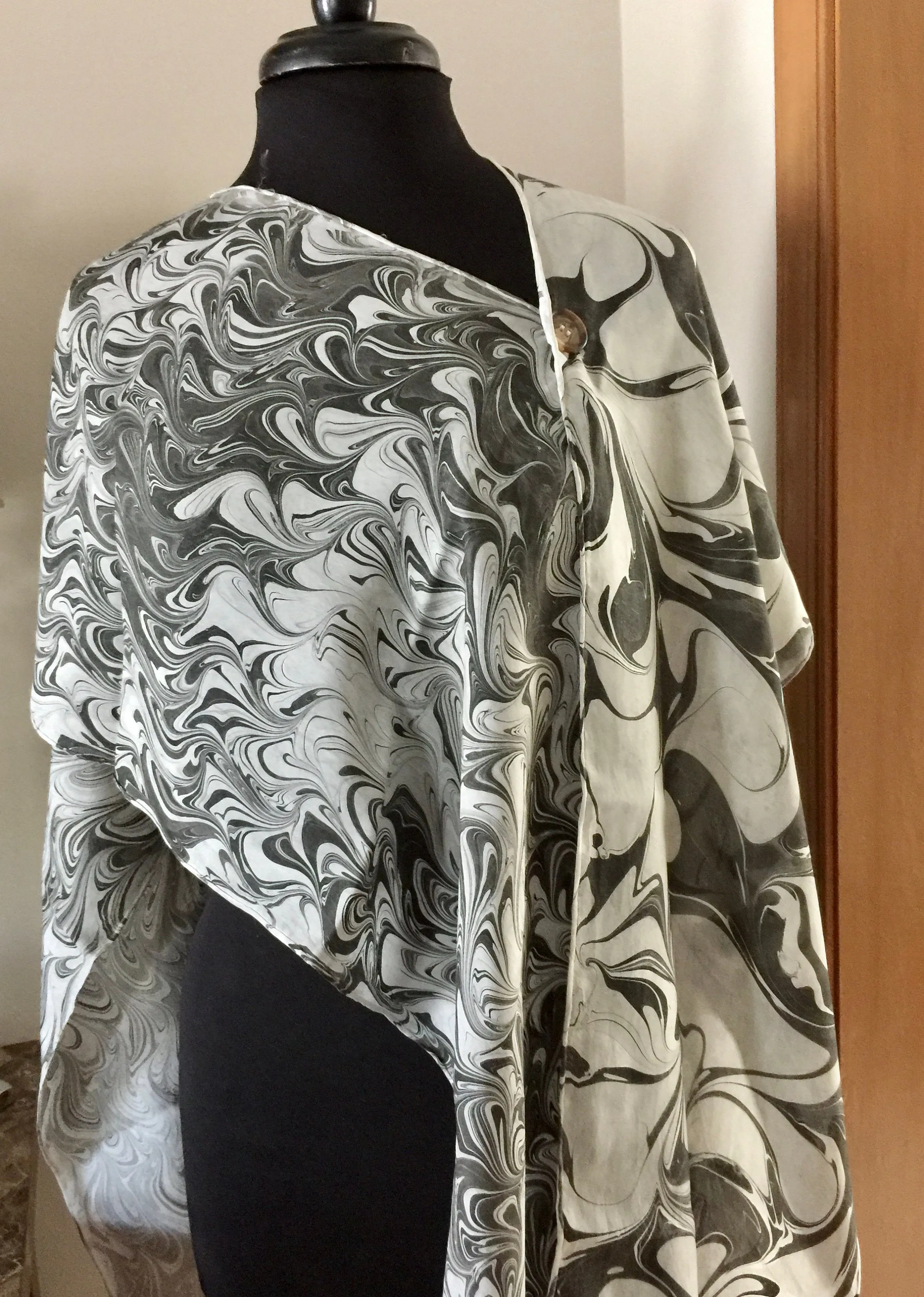 The Shibumi.  It’s a wrap, a shawl, a fashion statement!  Wear it 10 different ways!