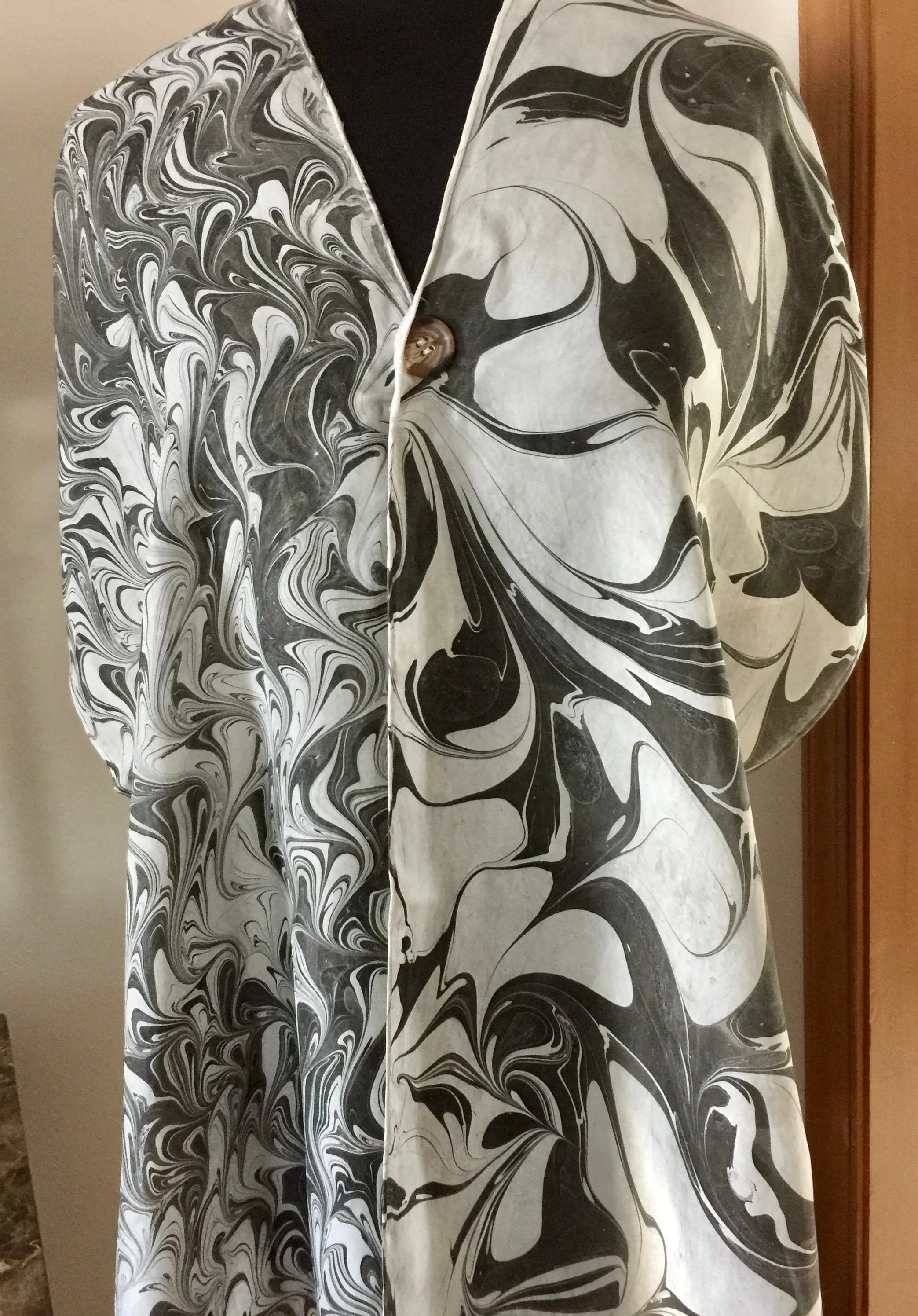 The Shibumi.  It’s a wrap, a shawl, a fashion statement!  Wear it 10 different ways!