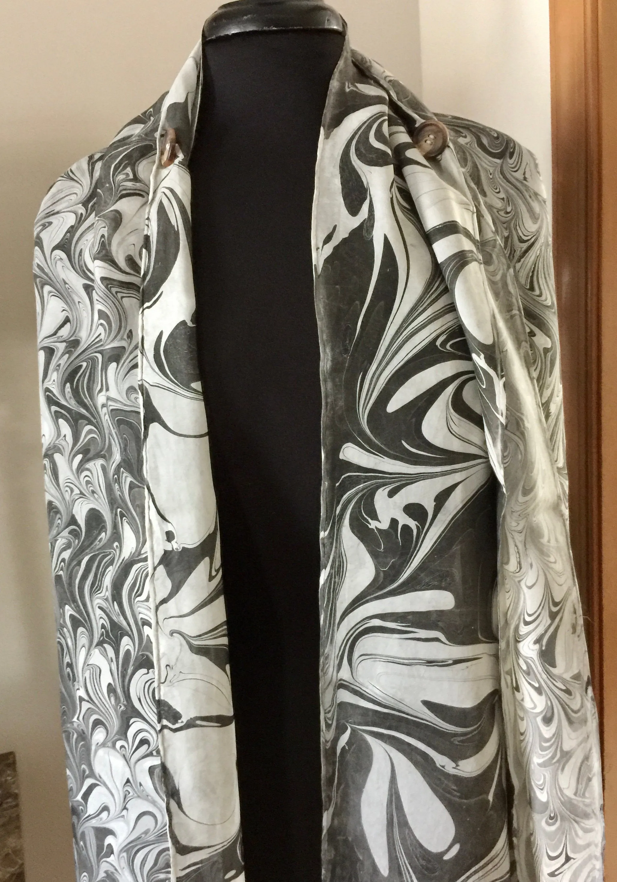 The Shibumi.  It’s a wrap, a shawl, a fashion statement!  Wear it 10 different ways!