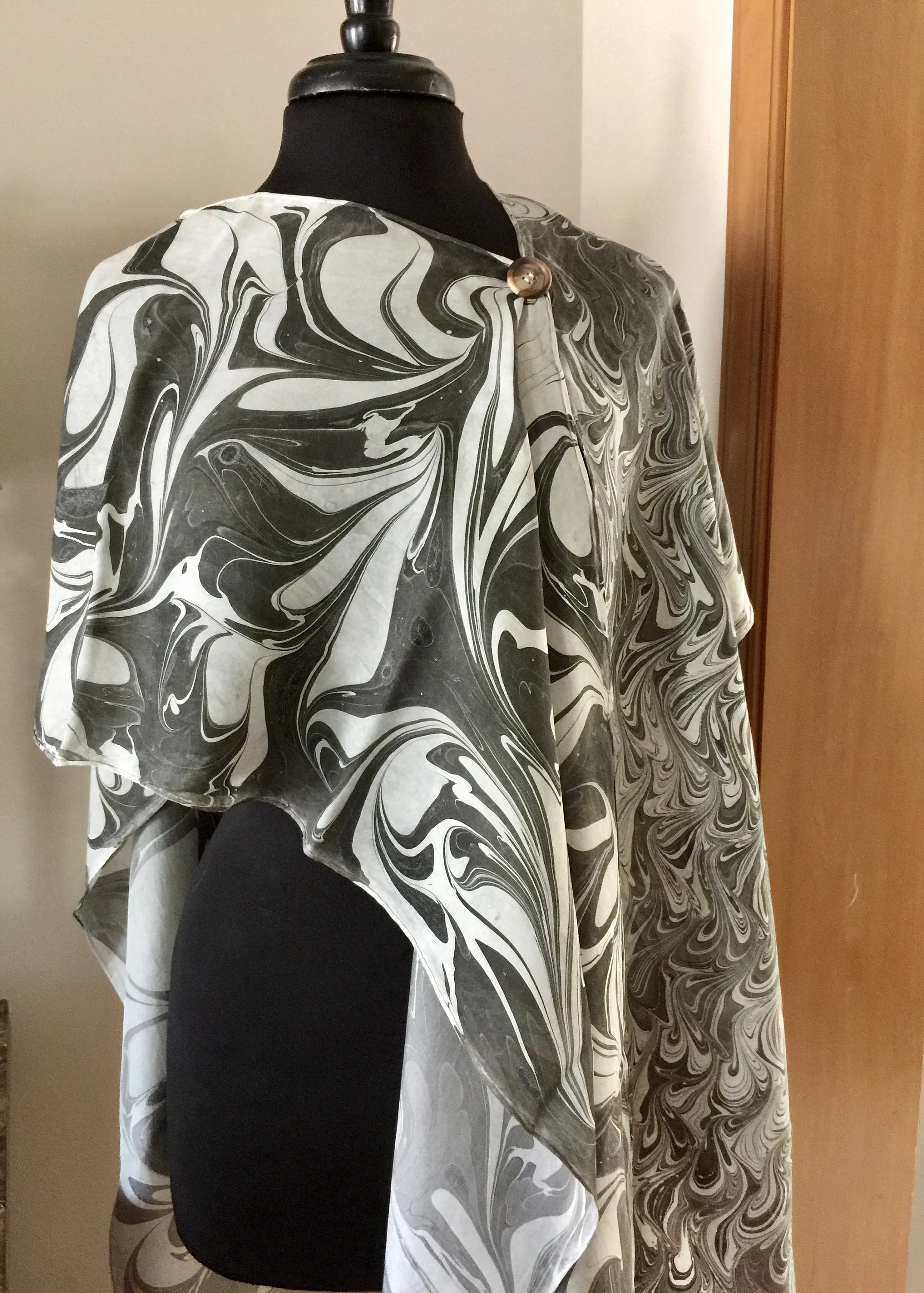 The Shibumi.  It’s a wrap, a shawl, a fashion statement!  Wear it 10 different ways!